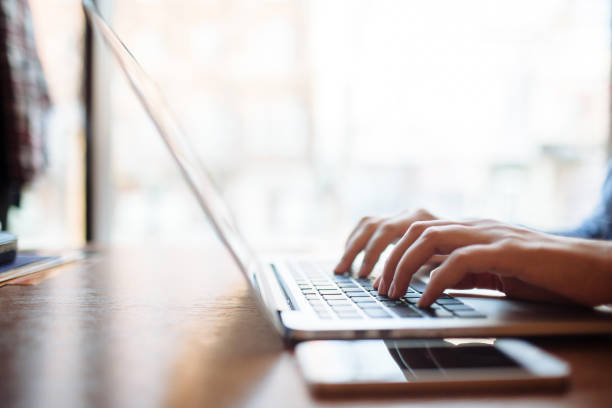 istock Girl in cafe with laptop 1151410285
