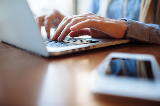 istock Girl in cafe with laptop 1151410335