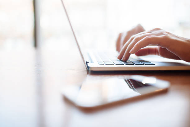 istock Girl in cafe with laptop 1151410349