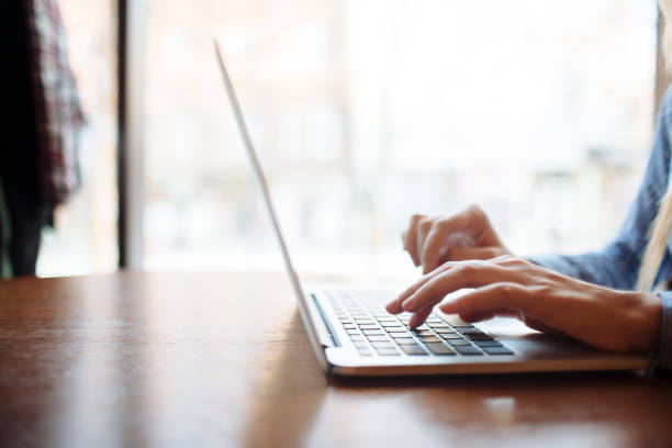istock Girl in cafe with laptop 1151410363