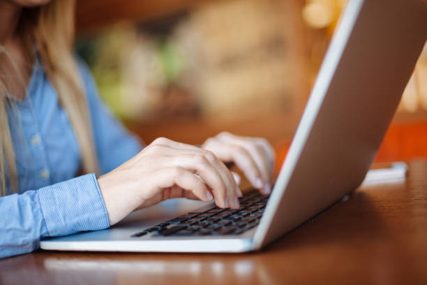 istock Girl in cafe with laptop 1151410534