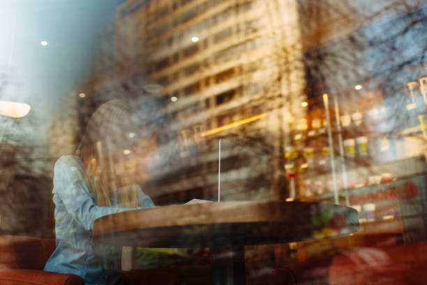 istock Girl in cafe with laptop 1151411042