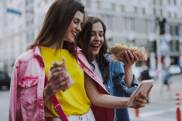 istock Happy females making selfie due lunch break 1151411407