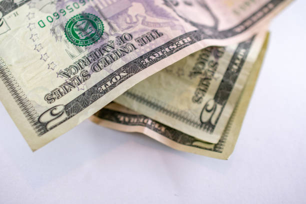 istock United States Currency five dollar bills in pile 1151412896