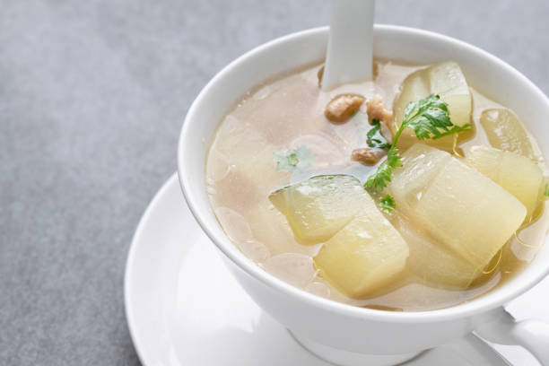 istock Boiled winter melon soup with chicken rib in white bowl on table. 1151415301
