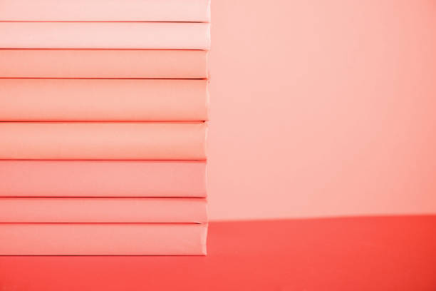 istock stack of books on living coral background 1151417922