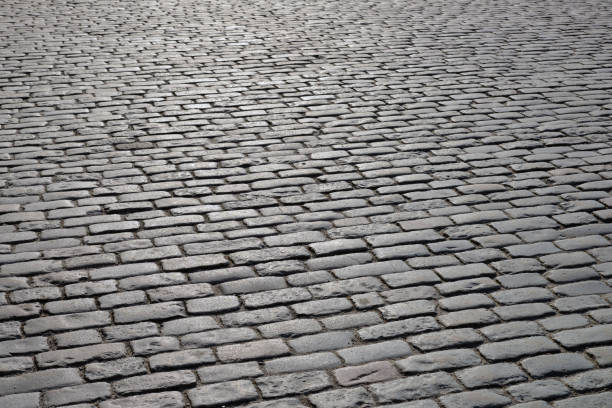 istock Old cobblestone pavement close up. 1151418168