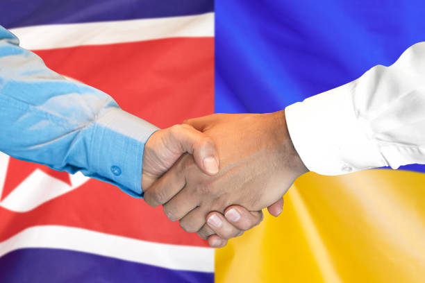 istock handshake on North Korea and Ukraine flag background. 1151422111