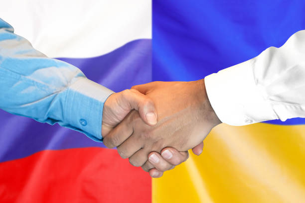istock handshake on Russia and Ukraine flag background. 1151422241
