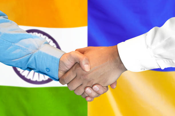 istock handshake on India and Ukraine flag background. 1151422543