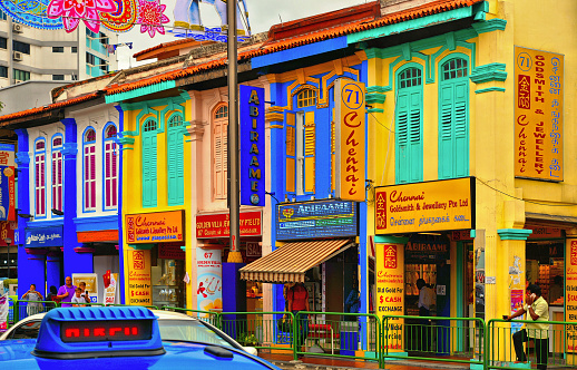 Singapore 25.08.2017. Colonial house with cars parked and people in Little India in Singapore. Little India is an ethnic neighbourhood found in Singapore that has Tamil cultural elements and aspects.