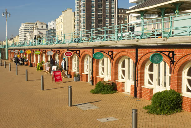 Brighton promenade, East Sussex, England Small shops on the seafront promenade at Brighton, East Sussex, England brighton england stock pictures, royalty-free photos & images