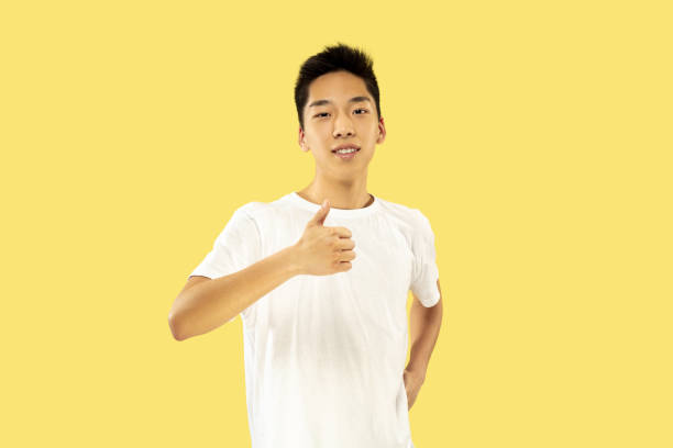 istock Korean young man's half-length portrait on yellow background 1151427053