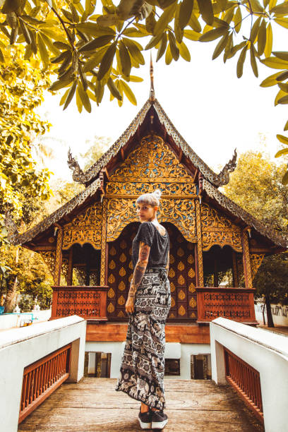 istock Young woman exploring temple in Thailand 1151428282