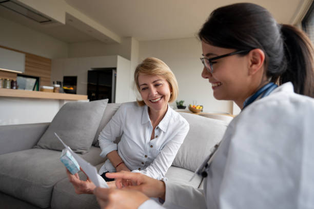 istock Doctor making a house visit and talking to a senior patient 1151429366