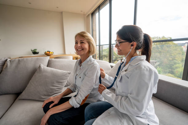 Doctor checking a patient's vital signs at home