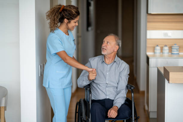 istock Disabled senior man greeting his home cargiver 1151432634