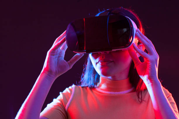 istock Young girl with VR goggles on head 1151432750