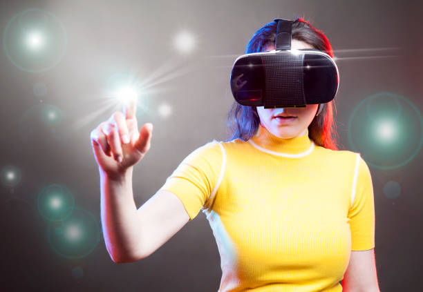 istock Young girl with VR goggles on head 1151432915