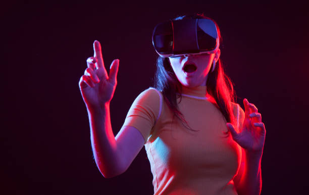 istock Young girl with VR goggles on head 1151433725
