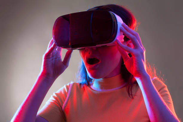 istock Young girl with VR goggles on head 1151433731