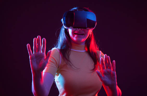 istock Young girl with VR goggles on head 1151433919