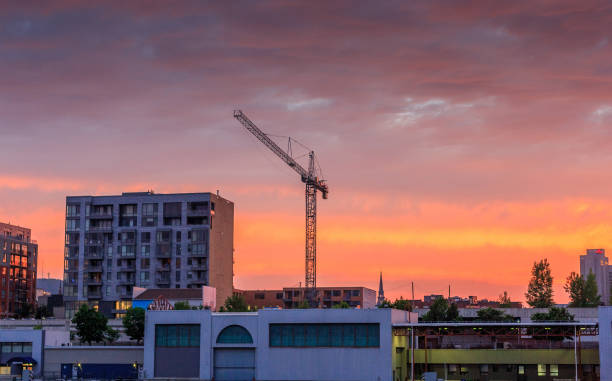 istock Old industrial crane and sunset clouds 1151438200