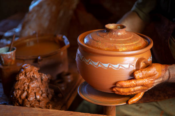 istock Senior Potter making clay pottery 1151439401