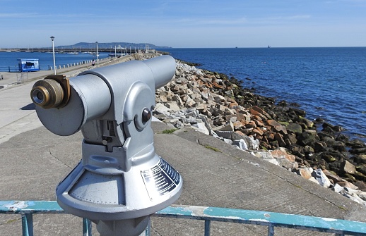 A public viewing telescope on Dun Laoghaire Pier looking out across the Irish Sea.