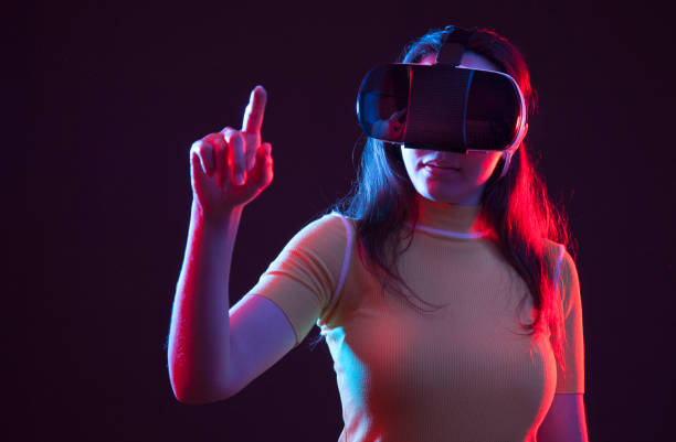 istock Young girl with VR goggles on head 1151440348