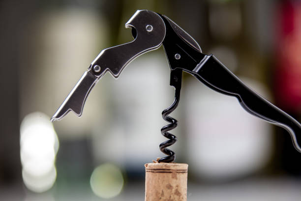istock Modern metal corkscrew against the background of wine 1151441993