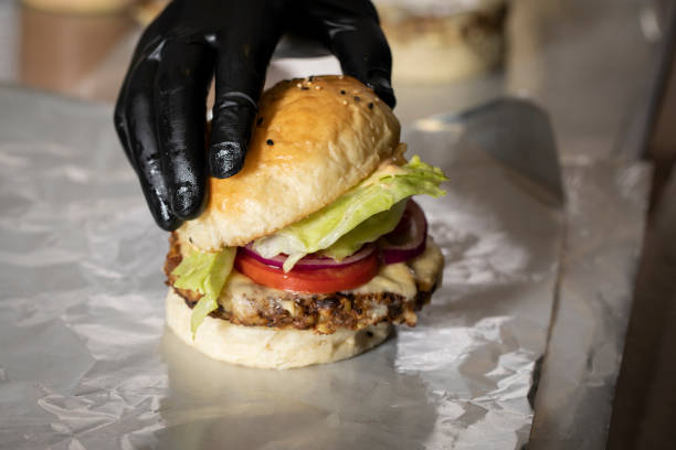 istock Chef finishing the hamburger 1151446063