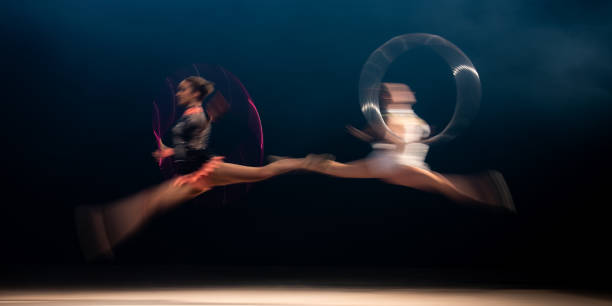 istock Two female dancers in blurred motion 1151449462