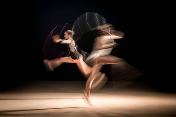 istock Two female dancers in blurred motion 1151449481