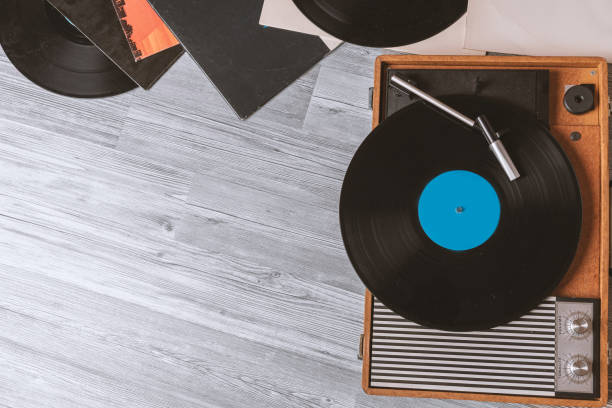 istock Gramophone on gray wooden table 1151450768