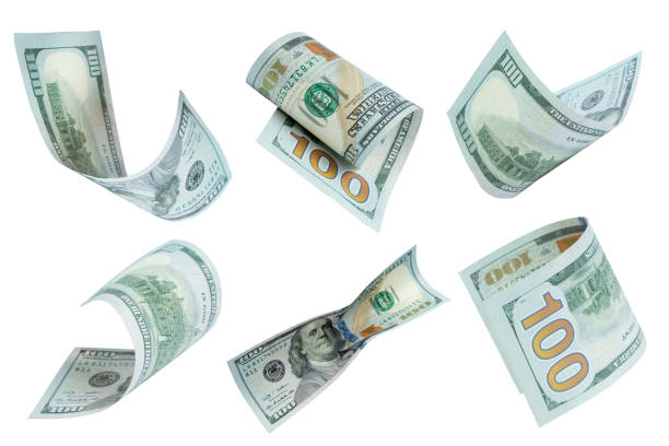 istock Flying money on white background. dollars, banknotes. 1151452288
