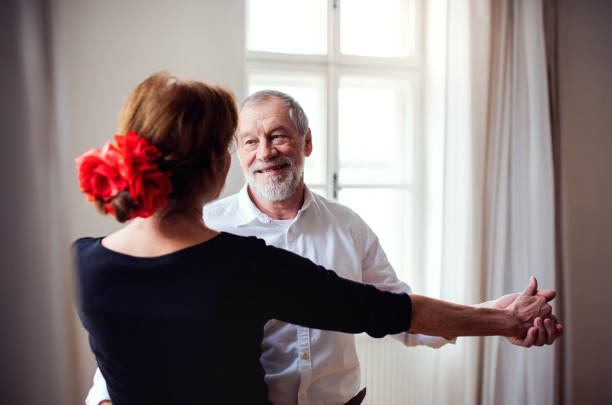 istock Senior couple attending dancing class in community center. 1151458272