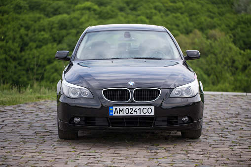 Zhytomyr, Ukraine - May 14, 2019: BMW 530d 5 series. The car was released in 2004. BMW stands on a hill near the cliff down. BMW is a german automobile manufacturing company based in Munich, Bavaria.