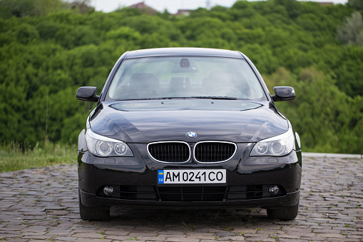 Zhytomyr, Ukraine - May 14, 2019: BMW 530d 5 series. The car was released in 2004. BMW stands on a hill near the cliff down. BMW is a german automobile manufacturing company based in Munich, Bavaria.