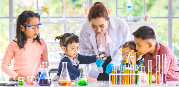 istock Teacher and students, smoke float out from blow. 1151464032