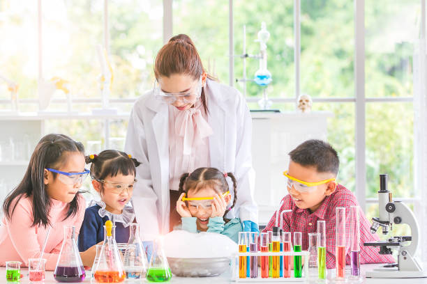 Teacher and students in lab, smoke float out.