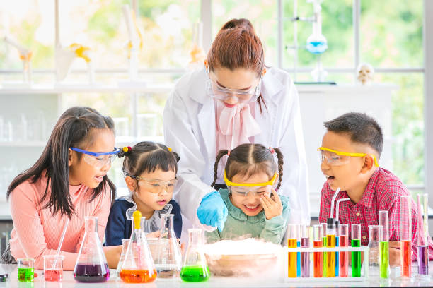 istock Teacher and students in lab, smoke float out. 1151464947