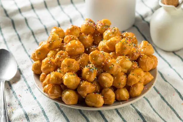 Homemade Sweet Italian Struffoli with Honey and Sprinkles