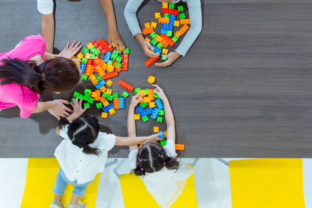 istock Kids and teacher playing on table 1151465858