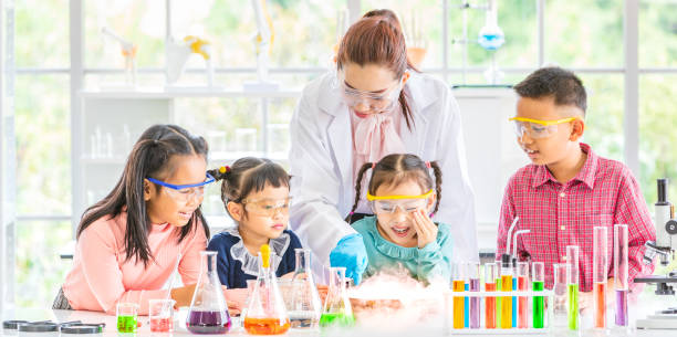 istock Teacher and students in lab, smoke float out. 1151465917