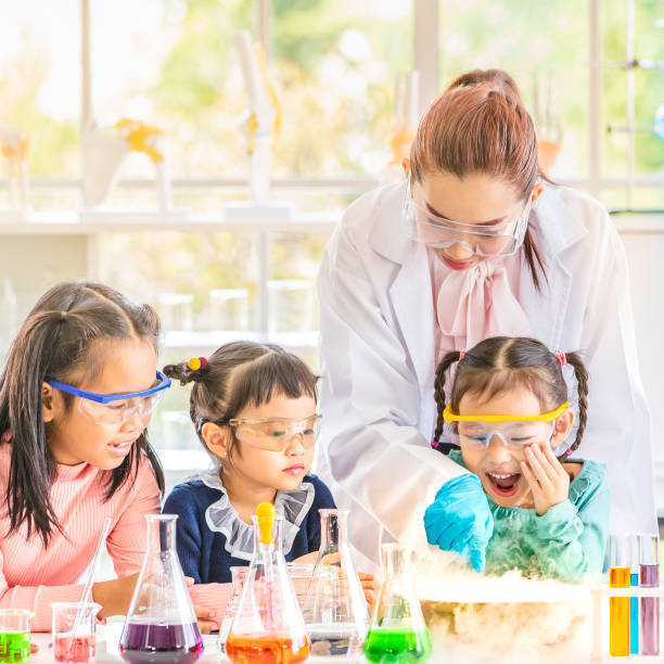 istock Teacher and students in lab, smoke float out. 1151466120