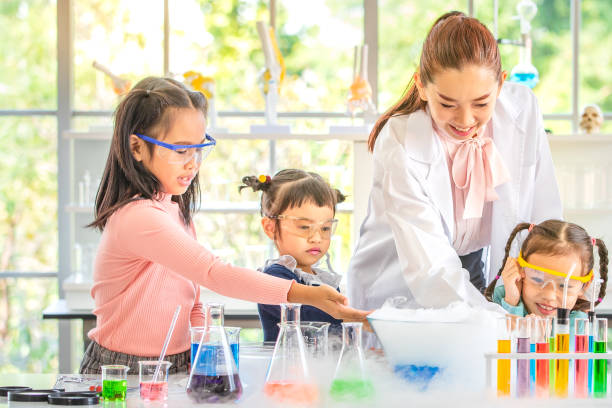 istock Teacher and students, smoke float out from blow. 1151466247