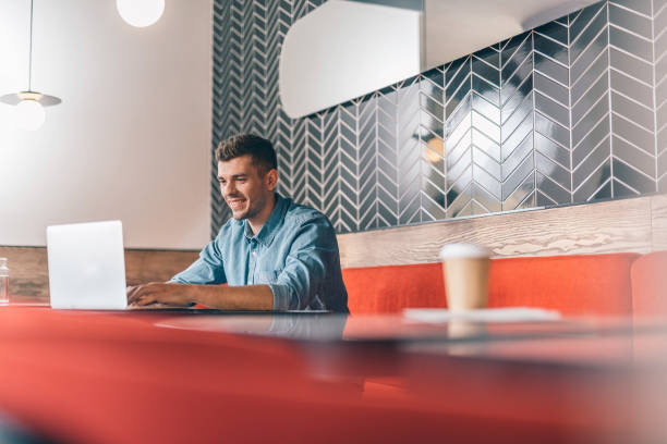 istock Man working on the laptop in comfortable cafe 1151466880
