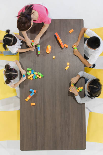 istock Kids playing colorful toys. 1151467424