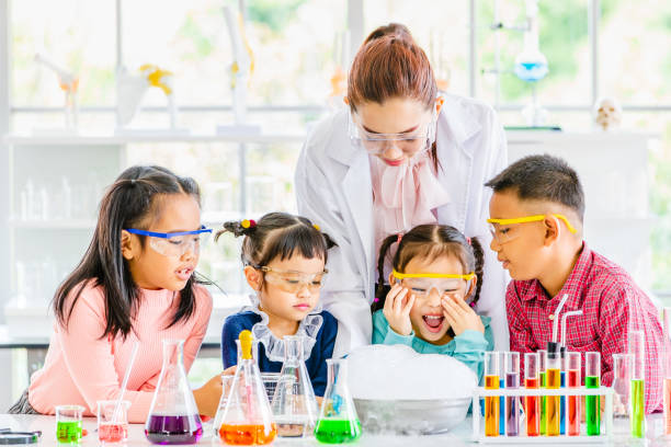 istock Teacher and students in lab, smoke float out. 1151467447